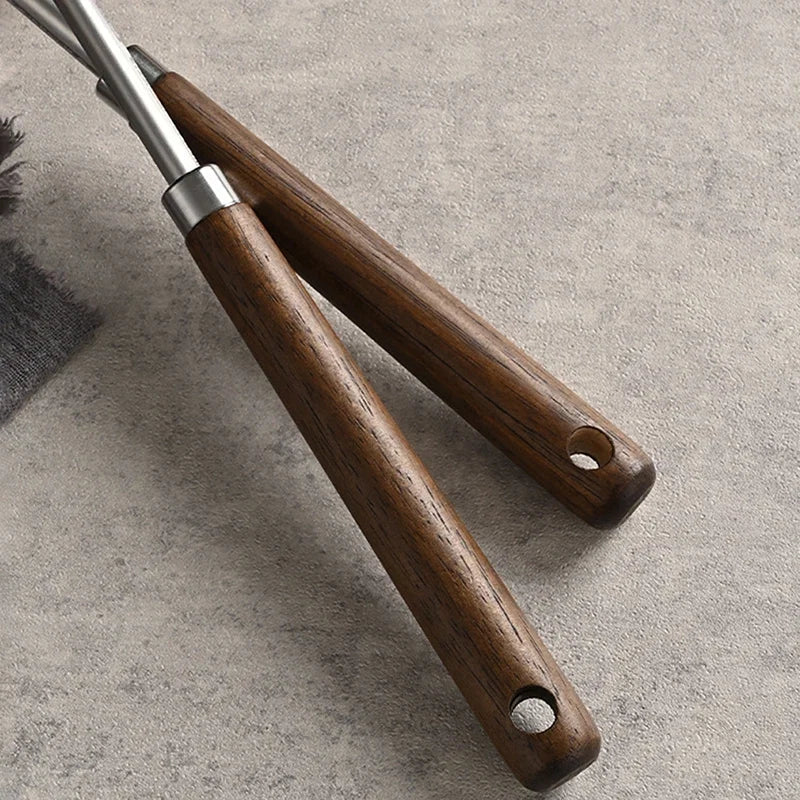Espátula de acero inoxidable con mango de madera